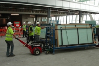 Power Pusher and steerable glass stillages at Heathrow T5