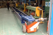 Power Pusher with integrated trolley for moving steel bar